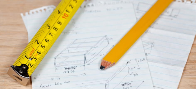 paper with tape measure and pencil