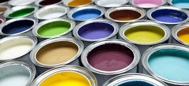 dozens of open paint cans