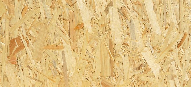A close-up image of oriented strand board, or OSB.
