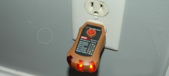 outlet tester plugged into wall socket