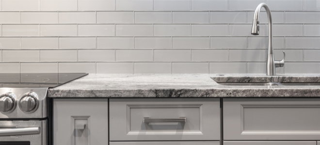 kitchen counter with tile backsplash 610945