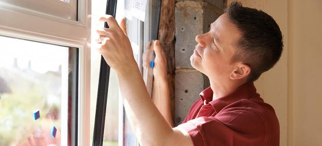 Man installing a window