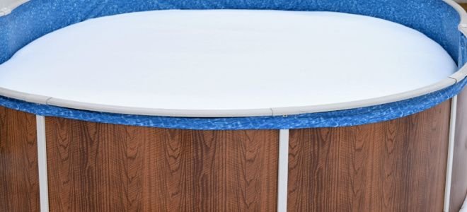 covered above ground pool with snow