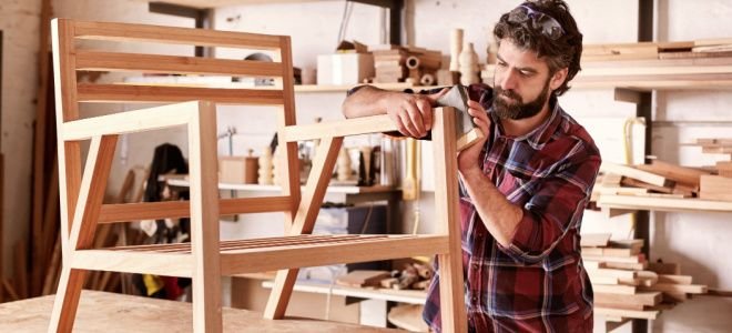 man building wood chair