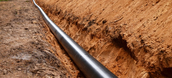 long dirt trench with gas pipe