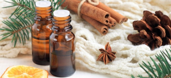 essential oils with cinnamon, orange, and pine
