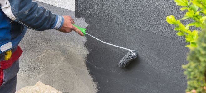 hand painting concrete with roller