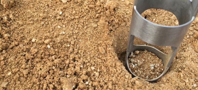 metal drill testing soil density on dirt ground