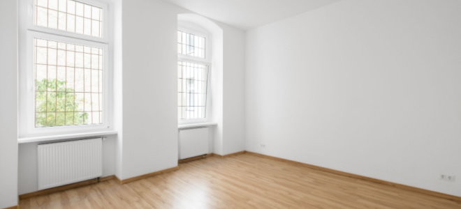 large windows in empty room with white wall