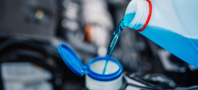 blue coolant going into a car