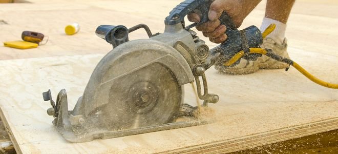 large circular saw cutting plywood