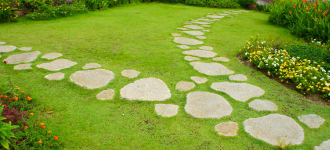 stone walkway through grass lawn