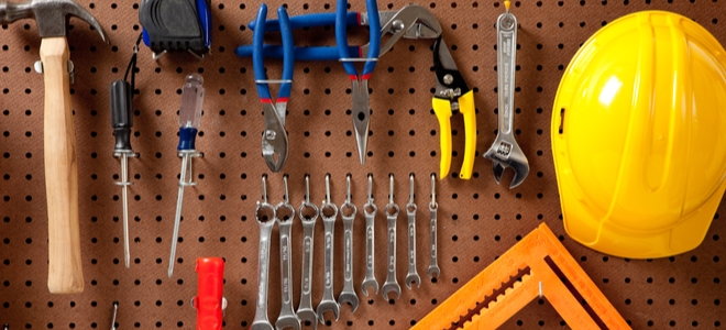 tools hanging on pegboard