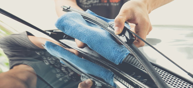 hand cleaning wiper blades with rag