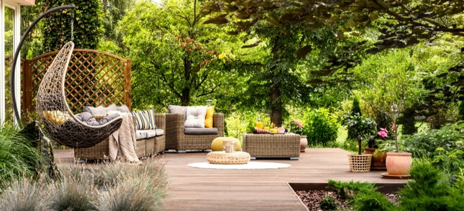 furnished deck surrounded by natural landscape