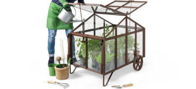 Bramber greenhouse on wheels with gardener and tools