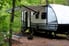 camper trailer parked in the woods
