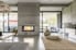 contemporary living room with concrete fireplace and natural tones