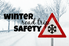 A snowy road with the words "winter road trip safety."