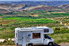 an RV with a landscape in the background