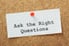 note on a corkboard that reads, "Ask the right Questions"