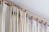 curtains hanging on rod with wooden rings