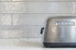 White tile backsplash with toaster in front