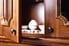 open wooden cabinet door with bowls inside