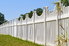 White picket fence in a yard.