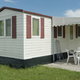 small mobile home with awning off the side