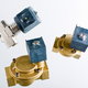 Three isolated solenoid valves against a gray background.