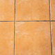 tan tile floor with dirty grout