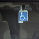 handicapped sign hanging inside a car