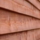 How to Put Wood Siding over Brick
