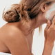 a woman applying a facial scrub