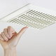 hand near a ceiling exhaust fan