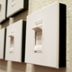 a group of dimmer switches mounted on a cream colored wall