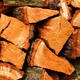 A close-up of a stack of firewood.