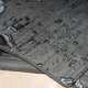 Rubber car mats with water droplets on them.