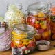 various vegetables pickled in jars