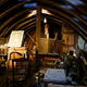 A dimly-lit attic full of antique junk.