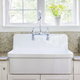 deep white kitchen sink with silver faucet