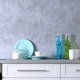 gray wall with texture in kitchen with blue design elements