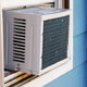 window air conditioner in blue house