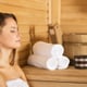 Woman relaxing in a sauna