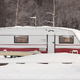 Travel trailer parked in the snow