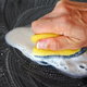 Use a sponge and detergent to scrub paint from plastic.