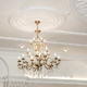 chandelier hanging from a white ceiling