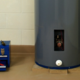 a water heater with a toolbox next to it