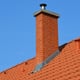 tile roof with chimney and metal flashing